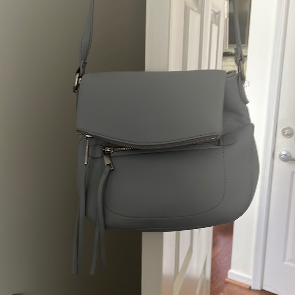A strap crossbody purse.